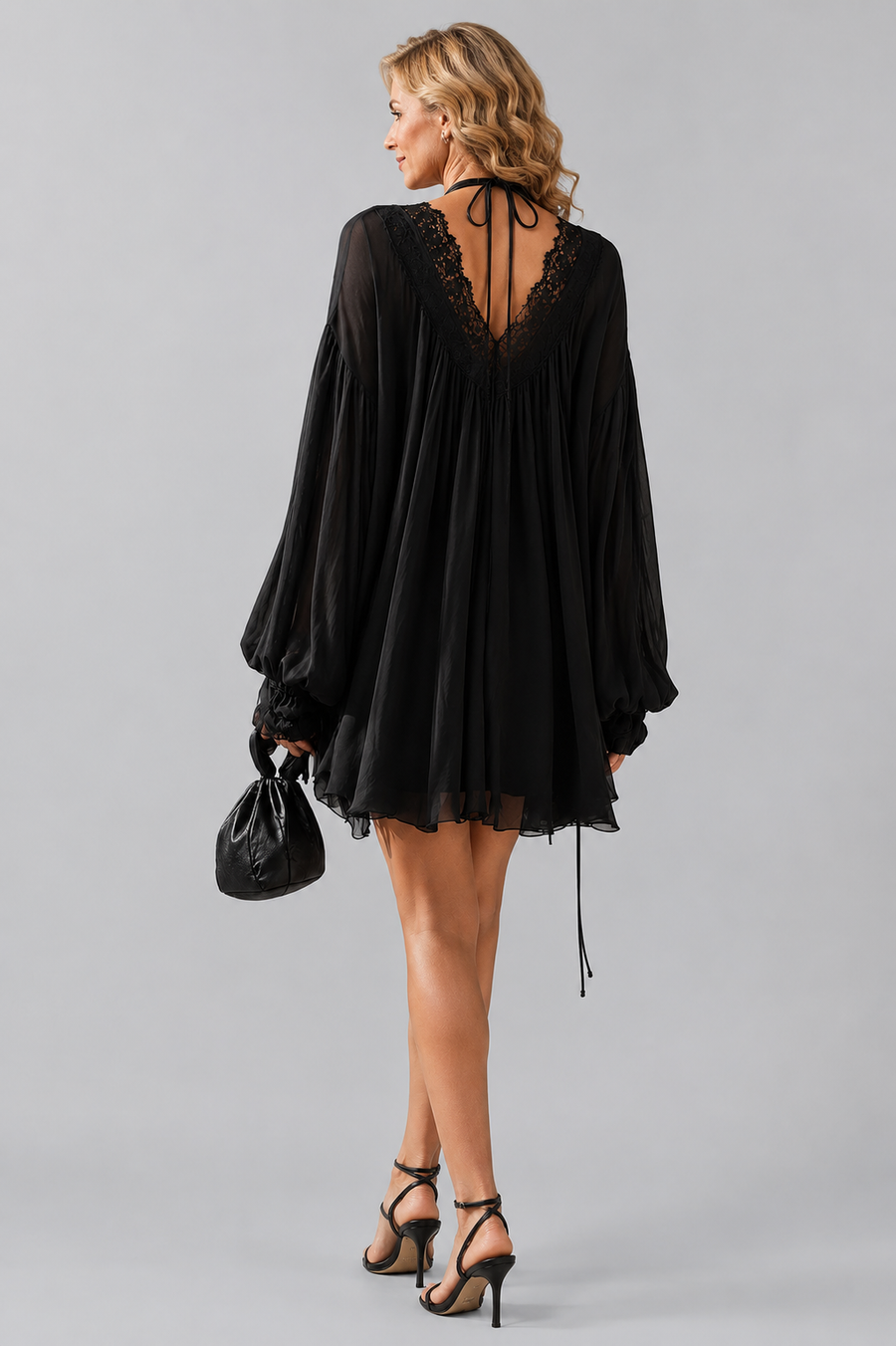 Black halter mini dress with lace neckline